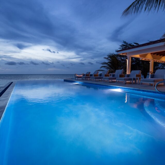 The pool at night at Manta Island, Belize