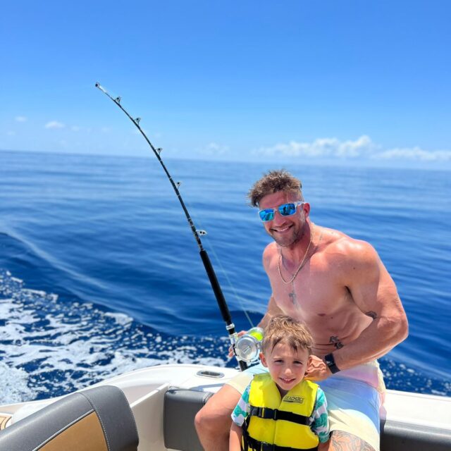 Dad and son fishing in Belize