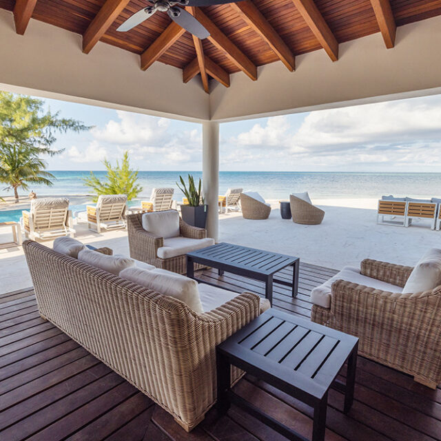 Cozy sitting corner in the al fresco lounge area of the Black Coral Restaurant with ocean view.