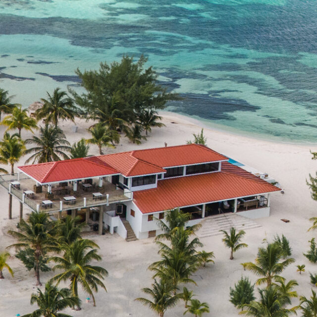 Aerial view of the Black Coral Restaurant with the ocean in the background.
