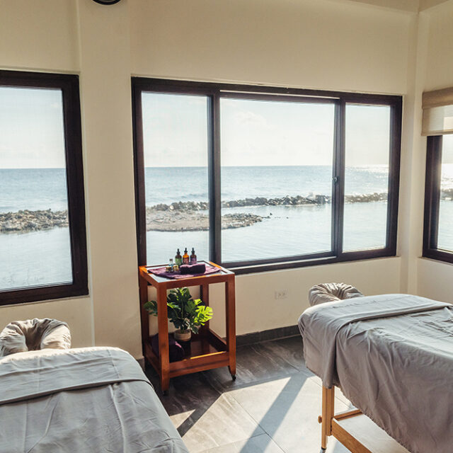 Two massage beds with picturesque views of the reef at Manta Island Resort.