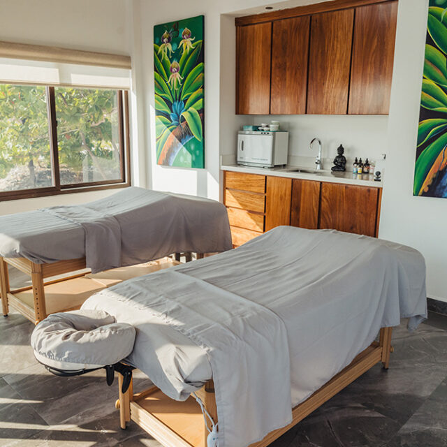 Sunlit Tranquil Tides spa at Manta Island Resort with two massage beds.