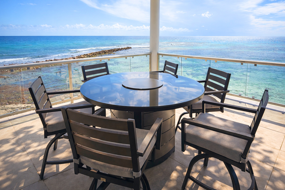 Oceanfront terrace dining at Manta Island Resort Belize
